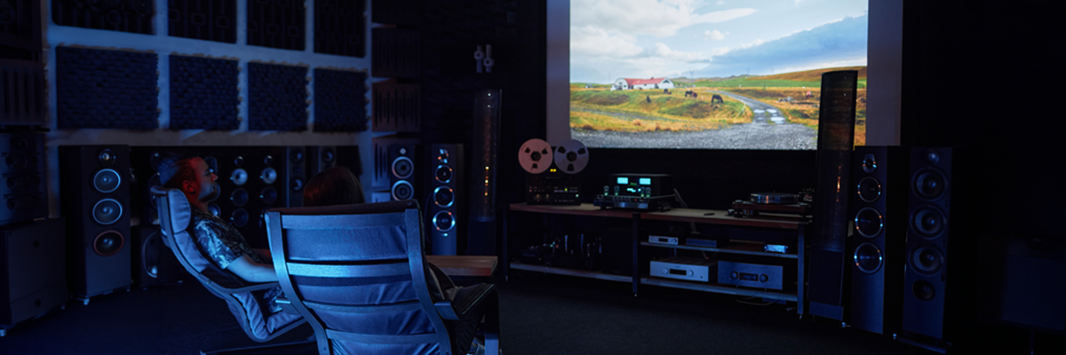 adults relaxing in home theater room