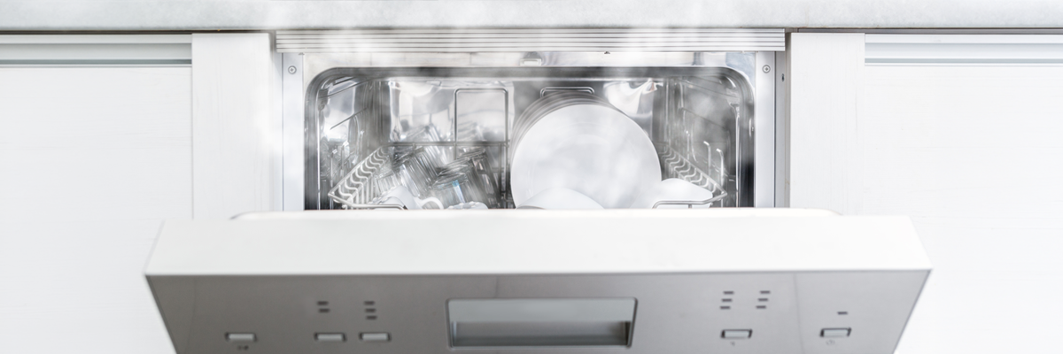 modern dishwasher with clean dishes inside open