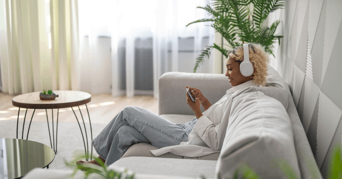 82-woman-lounging-listening-to-music-at-home-630.png 